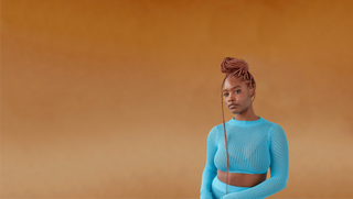 Hero image of woman wearing braidbetter in the color Spice